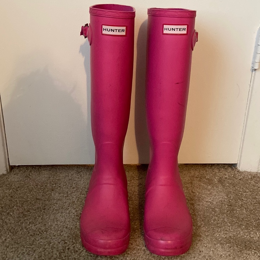 Bright pink HUNTER tall rain boots